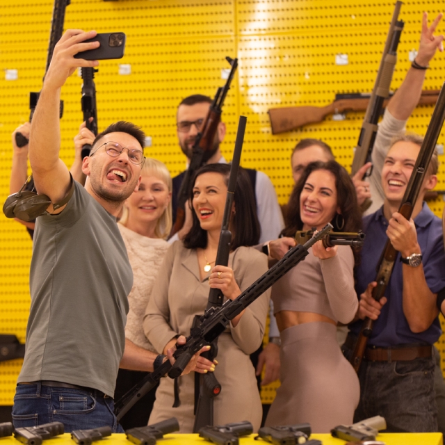 Birthday party people taking a group selfie